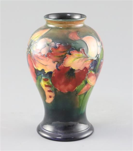 A Moorcroft orchid flambe small baluster vase, 1930/40s, H.15.2cm